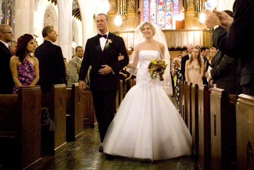 Bride and groom walking down the aisle after their wedding ceremony.
