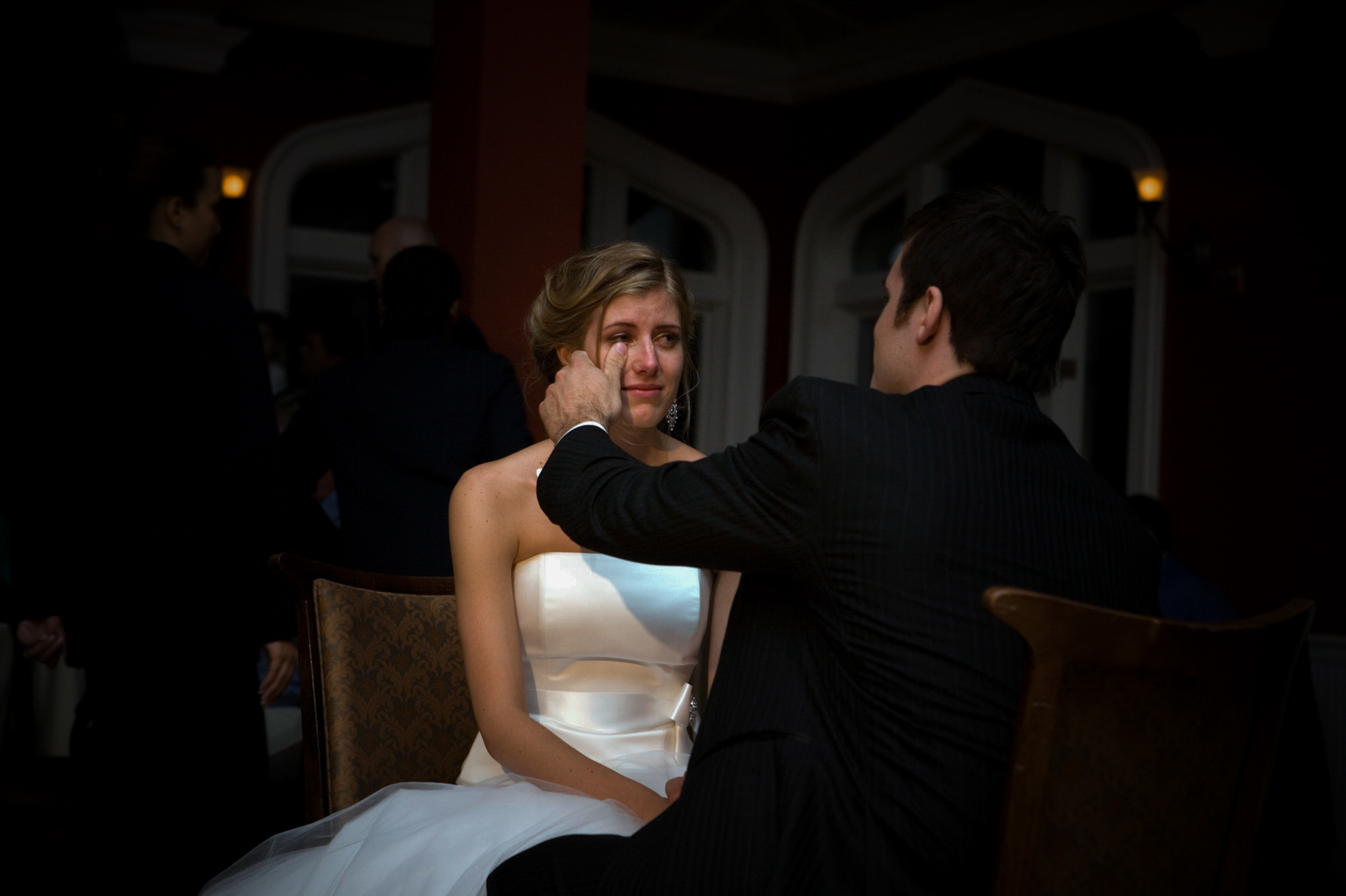 Bride smiling warmly at groom during wedding ceremony.
