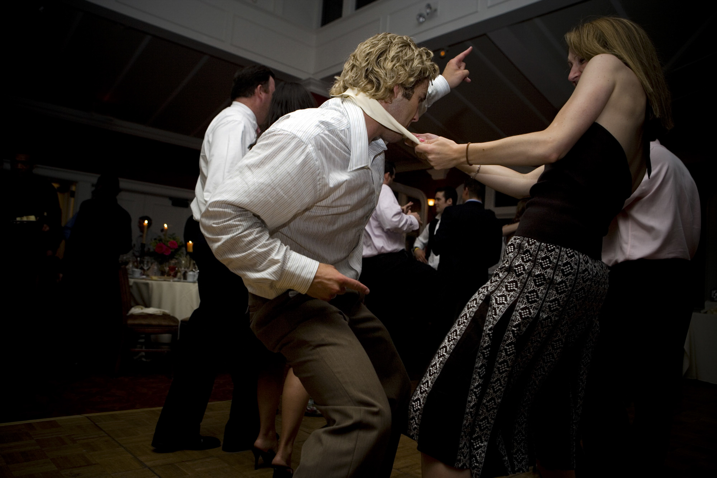 People dancing energetically at a lively party.