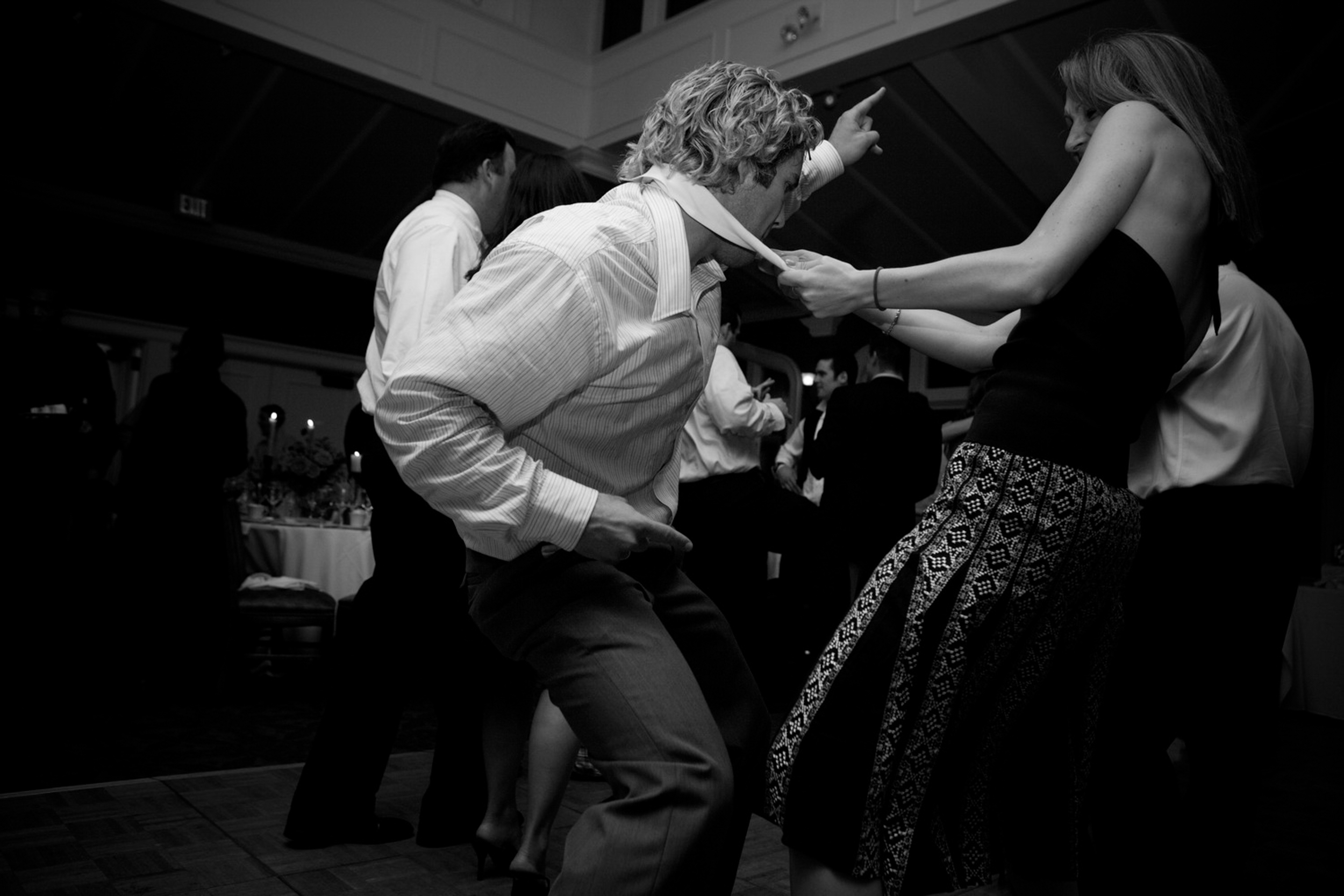 People dancing energetically at a lively event.