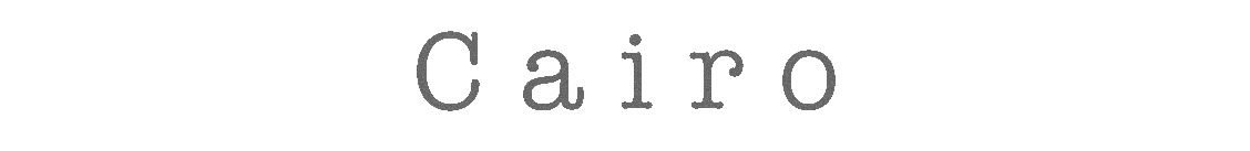 Close-up of gray typewriter keys spelling 'a i r'.