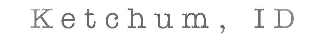 Close-up of the word 'unusual' typed in a typewriter font.